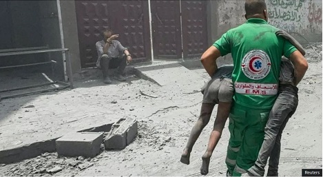 Footage showed rescuers carrying away the wounded and searching for survivors in the wreckage as dust filled the streets