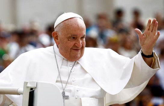 Pope Francis greets people as he arrives for the weekly general audience at Saint Peter's Square at the Vatican on June 19, 2024