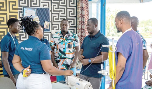 Kofi Baah Agyepong (2nd from right), CEO of the Youth Employment Agency,  interacting with some of the beneficiaries