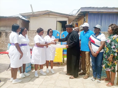 Carlos Kingsley Ahenkorah, (5th from right), MP ,Tema West Constituency, handing over some medical equipment to Vivian Gwira,(4th from left), Greater Accra Chief Nursing and Midwifery Officer. Picture: BENJAMIN XORNAM GLOVER.