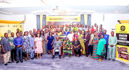 Ehunabobrim Prah Agyensaim VI (seated middle), Chairman, GHACEM Cement Foundation, with representatives of beneficiary institutions