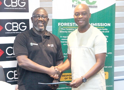  Daniel Wilson Addo (left), Managing Director of Consolidated Bank Ghana Limited, and Hugh C. A. Brown, Executive Director of  the Forest Services Division of the Forestry Commission, after the signing of the MoU. Picture: CALEB VANDERPUYE 