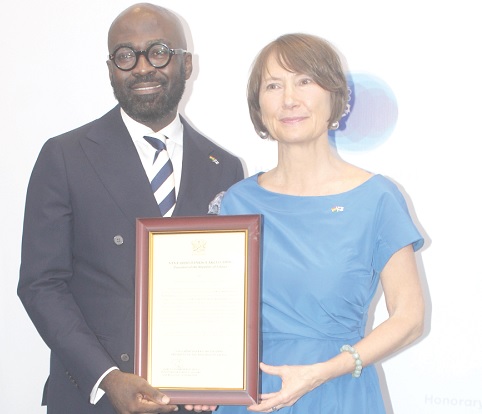Leena Pylvänäinen (right), Finnish Ambassador to Nigeria, Ghana, Benin and Liberia, presenting a citation to Elikem Nutifafa Kuenyehia (left), the Honourary Consul of Finland in Ghana.   Picture: ESTHER ADJORKOR ADJEI