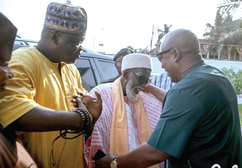John Dramani Mahama (right) exchanging pleasantries with Sheikh Usmanu Nuhu Sharubutu, the National Chief Imam, at the conference