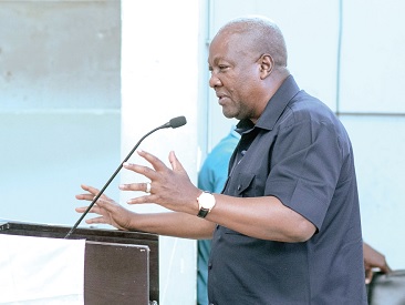 Former President Mahama (right) addressing members of the Ghana National Association of Private Schools in Accra