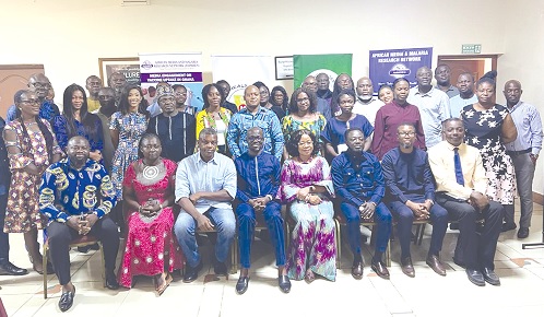Dr Kwame Amposa-Achiano (4th from left), Manager of the Expanded Programme on Immunisation, Dr Charity Binka (4th from right), Executive Secretary of AMMREN, editors and other health experts at the forum