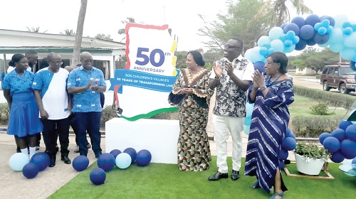Rebecca Akufo-Addo (3rd from right), the First Lady; Nathan Kwabena Anokye Adisi (2nd from right), Alexander Kekula (3rd from left) and Christian Appiah (2nd from left), Board Chair, SOS Children's Village Ghana, together unveiling the 50th anniversary logo. Picture: BENJAMIN XORNAM GLOVER