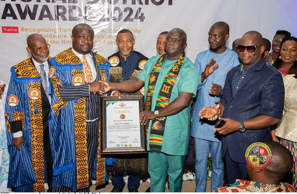 Nana Poku Agyemang (2nd from left), a  Fellow of the Ghana Institution of Engineers, presenting a citation to Samuel Nii Adjei Tawiah (3rd right), at the event