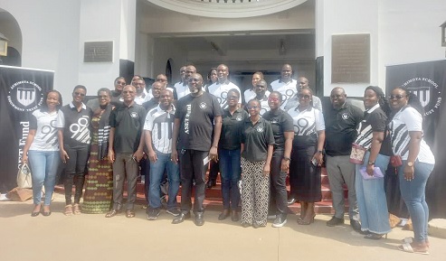 Joel Nettey (6th from left), President of the Old Achimotans Association, with other old students of the association after the launch