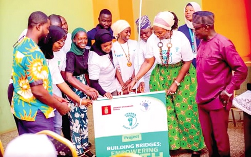 Alima Saeed Sagito ( 2nd from right), Executive Director of SWIDA Ghana, being supported by some youth to launch the project