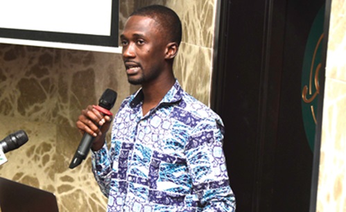 Dr Raphael Awuah (right), a co-investigator of the CARE Diabetes team, making his presentation at a dissemination meeting of the study on diabetes  held in Accra