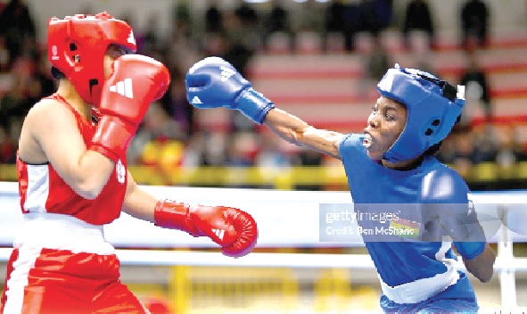 Yi-Xuan Guo of Chinese Taipei (left) in action against Janet Acquah of Ghana during their women's 50kg Round of 32 bout