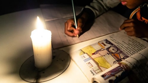 Schoolchildren have been studying by candlelight (file photo)