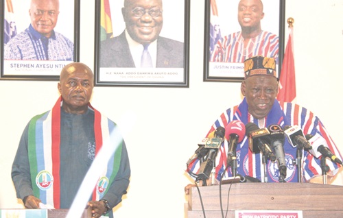 Dr Abdullahi Umar Ganduje (right), the National Chairman of Nigeria's APC, addressing the press during his visit to the NPP headquarters as Stephen Ayesu Ntim (left), the National Chairman of the NPP, looks on 