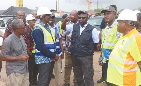 Francis Asenso-Boakye (2nd from left), Minister of Roads and Highways, speaking to Kwabena Bempong (right), Chief Resident Engineer, Ofankor–Nsawam road project. With him are Abass Awolu (left), Chief Director, Ministry of Roads and Highways, and some officials of the ministry. Picture: ELVIS NII NOI DOWUONA