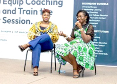 Skyvia Akwaboah (2nd from right), President of Soccer for Dreamers, and Eugenia Boadi, the training facilator, in an interaction session with participants