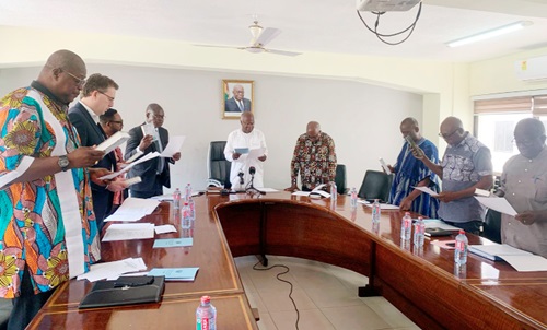 Kobina Tahir Hammond (arrowed), Minister of Trade and Industry, swearing in members of the newly constituted Cement Manufacturing Development Committee in Accra