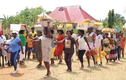 Some traders marching during the parade at the Independence Day celebration at the Pankese Presby Basic School park