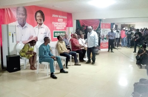 John Dramani Mahama (3rd from right) interacting with Kofi Brako, a former MP for Tema Central and freight forwarder, during the forum