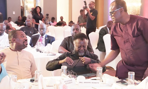 Isaac Bedu (right), Registrar, Engineering Council, explaining a point to Rev. Stephen Yaw Osei (left), Chief Director, Ministry of Works and Housing, in the meeting. With them is Dr Kwame Boakye (2nd from right), Board Chair, Engineering Council, Ghana Picture: EDNA SALVO-KOTEY