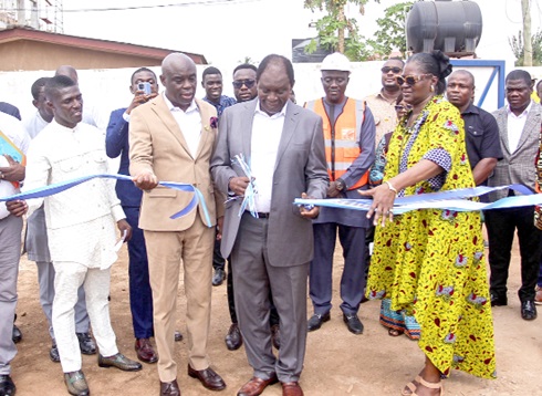 Dr Kofi Ohene-Konadu (2nd from right)  Chairman, UPSA Governing Council, cutting the tape for the commencement of work on the UPSA graduate hostel. Supporting him are  Prof. Abednego F.O. Amartey (2nd from left), Vice-Chancellor of UPSA; Dr Koryoe Anim-Wright (right), Registrar, UPSA, and Dr Michael Boadi Nyamekye (left), a lecturar of UPSA