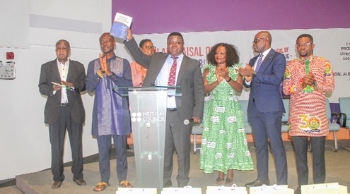 Prof. Peter Quartey (middle), Director of Institute of Statistical, Social and Economic Research, launching the book with the title ”An Appraisal of Ghana’s Public Procurement Regime”. With him are Prof. George Kodzo Novisi Vukor-Quarshie (left) and Michael Kofi Quashie (2nd from left), the authors of the book, with other dignitaries present. Picture: ESTHER ADJORKOR ADJEI