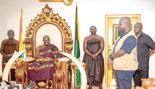 Francis Asenso-Boakye (right), Minister of Roads and Highways, addressing the Asantehene Otumfuo Osei Tutu at the Manhyia Palace in Kumasi