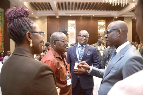 George Agyekum Donkor (right), President, Ecowas Bank for Investment and Development, interacting with some participants at the summit