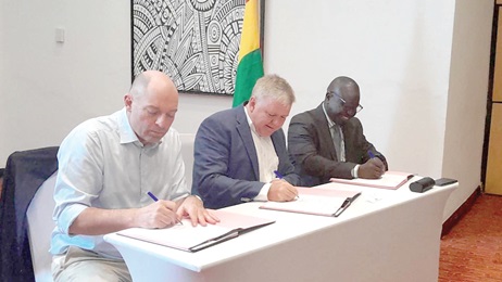Prof. Samuel Annim (right), the Government Statistician; Tom Norring (middle), Ambassador of Denmark to Ghana, and Carsten Zangenberg, Head of Communications and Sales, signing the agreement respectively