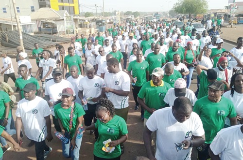 A section of the Tamale Teaching Hospital. Inset: Some management and staff of the hospital in a health walk as part of activities to mark the 50th anniversary celebration of the facility