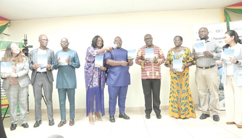 Ishmael Adjei Brown (5th from right), Director of Research, Statistics and Information Management, Ministry of Fisheries and Aquaculture Development; Dr Yaw Baah (4th from right), Secretary-General, TUC-Ghana; Philomena Aba Sampson (3rd from right), 2nd Vice-Chairperson, TUC-Ghana; Jodelen Mitra (left), Global Cordinator, ILO 8.7 Accelerator Lab Programme, and other dignitaries launching the policy document. Picture: EDNA SALVO-KOTEY 