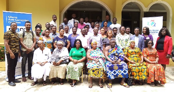 Beauty Emefa Narteh (seated right), Executive Secretary of GACC, Gawusu Abdul-Wadood (seated left), Bono Regional Director of CHRAJ, with other participants in Sunyani