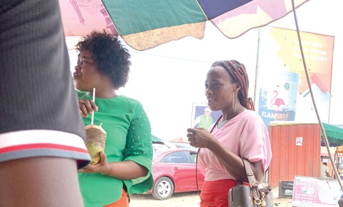 Some customers enjoying the fruit Some customers enjoying the fruit