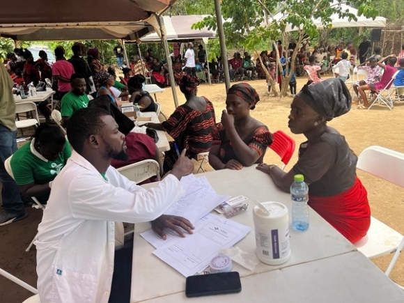 A doctor attending to patients during the health screening exercise