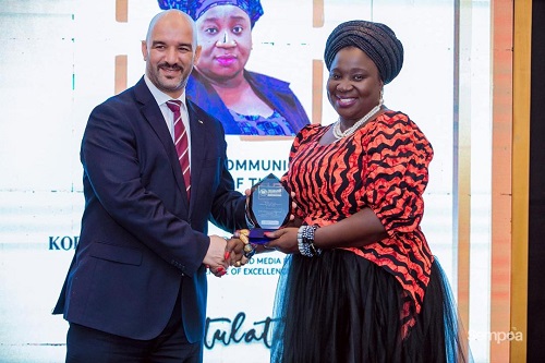 Kobi Hemaa (left) receiving her award 