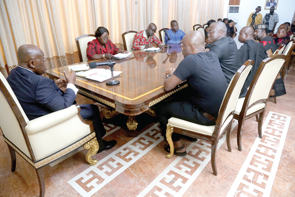 President Akufo-Addo (left) addressing the late John Kumah's family at the Jubilee House. Picture: SAMUEL TEI ADANO