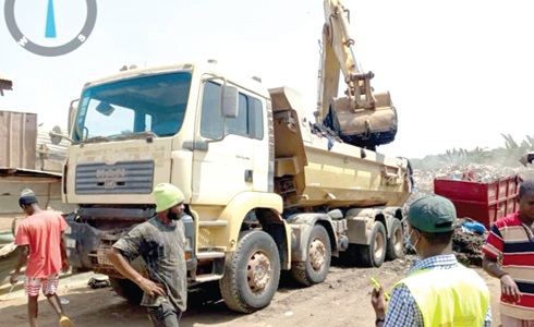 A tipper truck carting refuse from one of the dumpsites