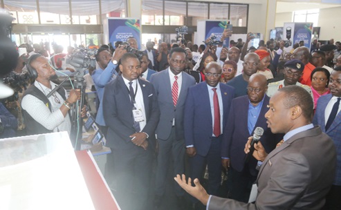 Dr Jojo Benin (right), Consultant of the One Tablet, One Student Initiative, explaining the Smart Schools Project to President Akufo-Addo (2nd from right), Vice-President Dr Mahamudu Bawumia and Dr Yaw Adutwum (3rd from right), Minister of Education, after the ceremony in Accra. Picture: SAMUEL TEI ADANO