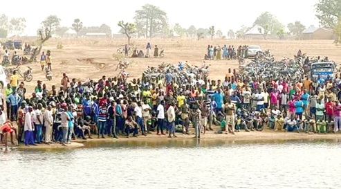 Hundreds of residents gathered around the dam during the rescue operation