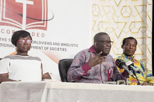 Christopher Ampadu (2nd from left), Executive Director of the Africa Centre for the Study of Worldviews and Holistic Transformational Development of Societies (CORAM DEO), explaining a point to participants in the event. Those with him are Adwoa Ampadu (left) and Joshua Afutu-Lamptey (right), both members of CORAM DEO. Picture: EDNA SALVO-KOTEY