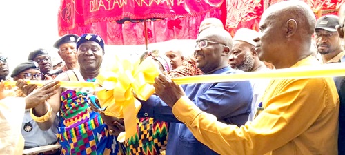  Dr Mahamudu Bawumia (2nd from right), Vice-President, being assisted by George Yaw Boakye (right), Ahafo Regional Minister, and Nana Boakye Bonsu (left), acting President, Duayaw Nkwanta Traditional Council, to cut the tape to inaugurate the school. INSET: The front view of the Duayaw Nkwanta Fire Academy and Training School Administration block