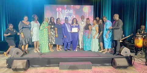 Dr Irene Stella Agyenim-Boateng (middle), HF-GhIE, displaying her honorary fellow certificate after receiving it from Kwabena Bempong, GhIE President