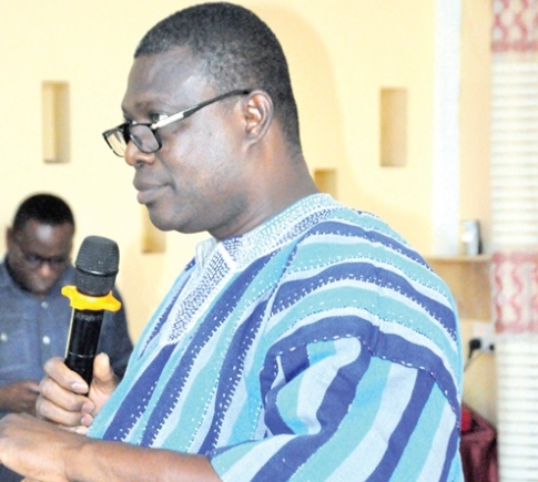  Dr Chrysantus Kubio (inset), Volta Regional Director of Health, addressing stakeholders in the meeting