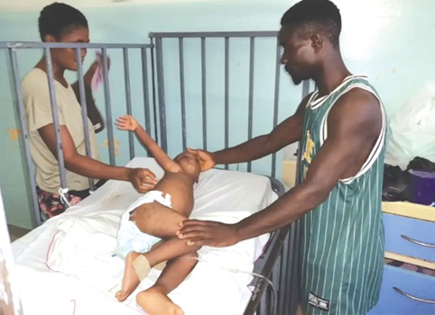 The child mauled by the dog receiving attention at the hospital