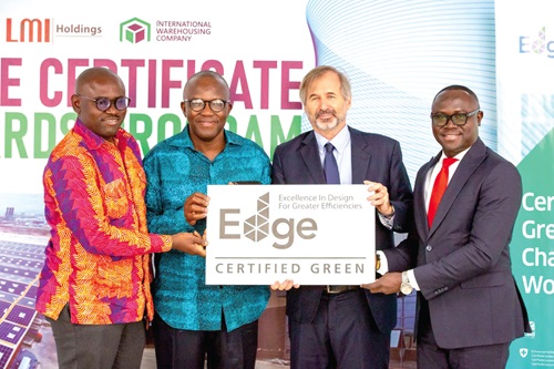 Kyle Kelhofer (left), IFC's Senior Country Manager, presenting the certificate to Emmanuel Apatae Manu (2nd from left), MD of LMI Logistics Group, Kojo Botsio Aduhene (2nd from right), CEO, LMI Holdings. With them are Joseph Ocran (right), Board Member, and Annabelle Obeng-Frimpong (middle), Business Coordinator, LMI Holdings