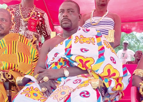 Nana Akoto Masakyi III (left), Paramount Chief of the Lolobi Traditional Area, sitting in state with some of his elders and queenmothers at the ceremony