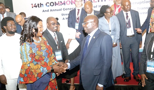 Dr Mahamudu Bawumia (right) in a handshake with COP Maame Tiwaa Addo Danquah (left),  Executive Director, EOCO, at the event in Accra. Picture: SAMUEL TEI ADANO