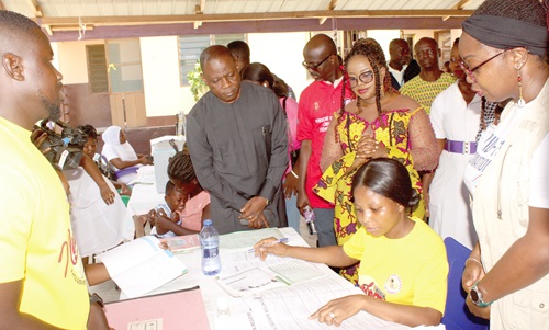 Dr Kuma-Aboagye (left), Director-General, GHS, inspecting the Covid-19 Vaccination process at Abokobi Health Centre