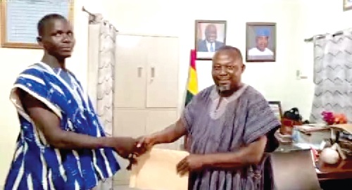 Some of the structures are at the roofing level. INSET: Kwame Kojo Mahamud (left), Spokesperson for the residents, presenting a petition to Mohammed Awolo, the Chereponi District Coordinating Director