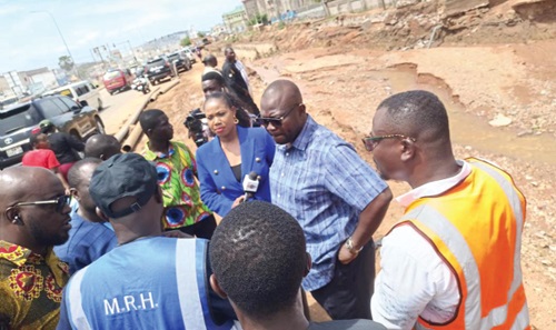  Francis Asenso-Boakye (2nd from right), Minister of Roads and Highway, engaging with the media after the inspection